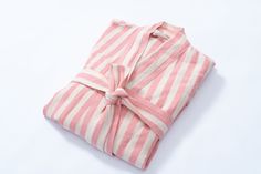 Introducing the Girit Pink Robe - a timeless blend of luxury and sustainability. Hand-crafted from exquisite linen in a soothing white and pink striped pattern, this robe epitomizes elegance and comfort. Embrace the softness of the natural cotton-linen blend while reveling in the eco-friendly ethos it represents. Its lightweight and breathable design makes it perfect for lounging or adding a touch of sophistication to your daily routine. Designed for a perfect fit on all body types, the Girit Pi Linen Robe, Cold Temperature, Pink Stripes, Natural Fabrics, Colour Tone, Natural Cotton, Cotton Linen, Linen Blend, Perfect Fit