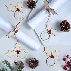 christmas decorations made out of toilet paper and napkins on top of a white table