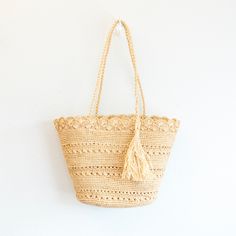 IN STOCK NOW SHIPPING FROM LOS ANGELES Take on any adventure with our handmade raffia straw bag! Its natural color and durability make it perfect for everyday use and the beach. With a strong shoulder strap, you can confidently carry all your essentials with ease. Upgrade your summer style with this bold and sturdy bag!Natural Soft Raffia StrawUnlinedHandmadeSize: 9"H x 13"W x 5.5''DStrap drop length: 10" Designer Style ID: 8668 Natural Palm Leaf Crochet Bag For Vacation, Natural Palm Leaf Beach Bag For Vacation, Handwoven Natural Bucket Bag For Beach Season, Natural Handwoven Bucket Bag For Beach Season, Travel Beach Bag With Braided Natural Fiber, Natural Straw Bag With Braided Details, Natural Fiber Shoulder Bag For Vacation, Natural Straw Braided Bag, Everyday Natural Braided Beach Bag