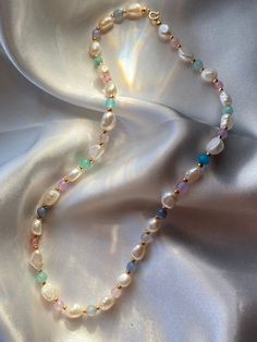 Our mermaid necklace is a handcrafted and it's made of pearls and gemstones.The gemstones are Multicoloured Jade and the pearls are freshwater pearls .the chain and clasp are 14K gold filled !! That means that the necklace won't tarnish or leave any green residue on your skin. <3 Please AVOID swimming in pools or the ocean while wearing it because chlorine and salt water is gonna damage the product. Mermaid Beaded Necklace, Pearl White Beaded Necklaces With Gemstone, Baroque Pearl Necklace With Gemstone Beads For Jewelry Making, Mermaid Accessories, Mermaid Jewelry, Mermaid Necklace, Wedding Jewellery Necklace, Jewelry Business, Wedding Necklace