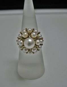 "For Sale is: (1) H077 Stunning Coctail (19) Pearl Ring in 14k Yellow Gold Please Read ENTIRE DESCRIPTION BEFORE PURCHASING This beautiful ring features cocktail ring with multiple (19) pearls in different size. Ring stamped 14k and it is size 5.5 This is a very elegant ring! Cosmetic Condition: This ring is in good condition. A few minor scratches due to age. AS SEEN IN PICTURE: Specifications: *14K Yellow Gold *Cocktail Style *Pearls (12) are approx. 3.4 mm (at the bottom of the ring) *Pearls Elegant Evening Rings With Center Stone, Elegant 14k Gold Diamond Ring For Evening, Elegant Yellow Gold Diamond Ring For Party, Classic Pearl Ring With Prong Setting For Formal Occasions, Classic Formal Pearl Ring With Prong Setting, Formal Classic Pearl Ring With Prong Setting, Elegant White Ring For Evening Occasions, Elegant White Ring For Evening, Formal White 14k Gold Pearl Ring