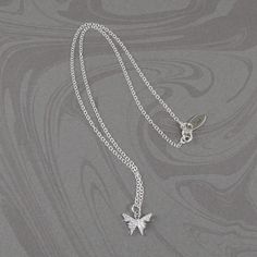 This beautiful crystal butterfly necklace is made with a dainty silver-plated crystal encrusted butterfly pendant and is suspended on a sterling silver chain with a sterling silver clasp. The necklace is available in five necklace lengths, please choose the necklace length you need from the drop-down menu. The necklace will arrive in an attractive gift box. Silver Minimalist Butterfly Necklace With Adjustable Chain, Silver Delicate Butterfly Necklace, Silver Butterfly Necklace With Delicate Chain, Silver Delicate Butterfly Necklace With Delicate Chain, Delicate Silver Butterfly Necklace, Silver Sterling Butterfly Necklace With Adjustable Chain, Silver Butterfly Necklace With Butterfly Clasp, Silver Butterfly Necklace With Delicate Sterling Chain, Silver Sterling Butterfly Necklace With Butterfly Clasp