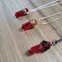 Beautifully elegant raw red quartz crystal pendant wire wrapped by hand and placed on a chain of your choice.  Length and shape of stones vary from 1-1.5 inches, as every stone is unique and magnificently perfect, and is wrapped by hand, so every pendant will look different.  Choose a necklace with chain and wire made from 18k gold plated stainless steel, dark sliver, or 925 sterling silver. All wire and chain is plated stainless steel, and length of chain is 18 inches. Please note that each necklace type is sold separately.  Be sure to check out more HANDMADE jewelry in my shop, DizzleBees, beautiful jewelry of all kinds available! Made with quality materials and always nickel and lead free metals ♡ Perfect gift for a friend or loved one: All jewelry pieces are packaged in silver silk jew Red Wire Wrapped Pendant Necklace, Red Gemstone Pendant Crystal Necklaces, Red Pendant Crystal Necklaces With Gemstone, Red Crystal Pendant Necklaces, Red Gemstone Pendant Crystal Necklace, Red Hand Wrapped Necklace As Gift, Hand Wrapped Red Necklace As Gift, Red Hand Wrapped Necklace For Gift, Red Crystal Gemstone Necklace For Gifts