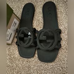 Brand New Only Worn Once! Gucci Open Toe Sandals With Buckle Closure, Gucci Sandals With Buckle Closure And Open Toe, Gucci Open Heel Sandals With Buckle Closure, Luxury Black Slides With Buckle Closure, Designer Flat Slides With Buckle Closure, Gucci Leather Flat Sandals, Gucci Leather Sandals Flat Heel, Designer Black Slides With Buckle Closure, Gucci Luxury Sandals With Cushioned Footbed