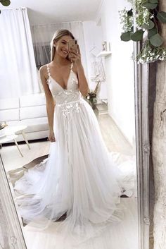 White V-neck Wedding Dress With Sweep Train, V-neck Lace Bodice Prom Gown, White V-neck Evening Dress For Prom Season, V-neck Tulle Gown For Prom Season, White V-neck Dress For Debutante Ball, V-neck Lace Prom Gown, White V-neck Wedding Dress With Lace Bodice, V-neck Wedding Evening Dress With Lace Back, White Gown With Sheer Bodice For Prom Season