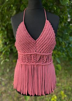 Handmade Macrame Top - a festival essential perfect for Valentine's Day, beach parties, and birthday celebrations. This pink boho-style top adds a touch of charm to your party wear, ensuring you stand out with style at every special occasion. Information: * Material: polyester cord. * Color: pink - ready to ship.  * Size: s-m  * Handmade by myself in Lithuania, Europe. * Size s-m in pink is ready to ship. For other sizes or other colors - please contact me by messages here on Etsy.  Care recommendations: hand-wash only with soup, no tumble dry, lay the garment out to dry on the flat surface, like a sofa, table or countertop. Shipping: ready to ship item will be dispatched in 1-3 business days. Made to order items may take additional 3-7 business depending on cord availability and your requ Bohemian Triangle Top Halter For Party, Bohemian Crochet Halter Neck Top For Summer, Summer Fringe Halter Top, Summer Fringe Halter Top For Party, Summer Party Fringe Halter Top, Summer Party Halter Top With Fringe, Summer Beach Halter Top With Fringe, Bohemian Halter Top For Beach Party, Bohemian Halter Top For Party