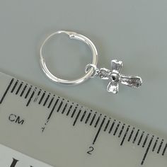 Comes with a detachable cross charm. The charm is multipurpose and can be used with a neck or bracelet chain too. Dimension: Hoop- 12 x 1.2 mm Cross: 7 x 12 mm Weight: 0.70gm Price listed is for a PAIR of hoops. These earrings are made of 925 hypoallergenic sterling silver and comes with a 925 stamp. Can be packaged in a gift box. I can include a personal message from you if needed You are welcome to contact me at... bhavnakwintra1956@gmail.com For more beautiful pieces from my shop, please brow Nickel Free Silver Huggie, Adjustable Small Hoop Earrings Nickel Free, Silver Nickel-free Huggie Hoop Earrings, Nickel-free Silver Huggie Earrings, Silver Hypoallergenic Dangle Hoop Earrings, Hypoallergenic Silver Dangle Hoop Earrings, Nickel-free Small Hoop Huggie Earrings In White Gold, Silver Adjustable Small Hoop Jewelry, Nickel-free Silver Dangle Huggie Earrings