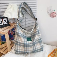 Brand Name: ARINOCHKAShape: Casual ToteMain Material: NylonOrigin: CN(Origin)Style: CasualInterior: Interior Slot PocketInterior: Interior CompartmentOccasion: VersatileClosure Type: zipperGender: WOMENDecoration: NONEExterior: NONELining Material: PolyesterModel Number: 3676Hardness: SOFTPattern Type: PlaidSize Measure: CMLength: 37cmWidth: 10cmHeight: 32cm Casual Portable Canvas Tote Bag, Fabric Backpack For Daily Use, Trendy Large Capacity Canvas School Bag, Large Capacity Square Canvas Bag For School, Everyday Fabric Backpack, Trendy Canvas Hobo Bag, Trendy Large Capacity Cotton Hobo Bag, Trendy Portable Canvas Travel Bag, Casual Square Shoulder Bag For School