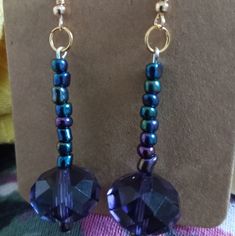 purple and blue beaded earrings on display