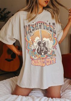 "Nashville Tee, Nashville T-shirt, Music City, Tennessee Tee, Vintage Inspired T-shirt, Unisex Tee, Comfort Colors T-shirt ✧ WHY YOU'LL LOVE IT ✧ ⋒ Comfort Colors® tees are garment-dyed shirts that are timeless classics and will never pile. ⋒ Trendy retro vintage look and gorgeous colors. ⋒ Amazingly soft and comfy. Perfect with any shorts, skirts, jeans, leggings, or nothing but undies around the house. ⋒ Created with quality in mind, it's made from 100% ring-spun cotton. ⋒ Will last for years Spring Concert Shirt With Graphic Print, Summer Music-themed Shirt With Screen Print, Short Sleeve Graphic Shirt For Music Festivals, Pop Culture Screen Print Tops For Concerts, Short Sleeve Graphic Print Shirt For Music Festivals, Music Festival Graphic Print Short Sleeve Shirt, Graphic Print Short Sleeve Shirt For Music Festivals, Summer Music-themed Tops With Graphic Design, Summer Music-themed Graphic Tops