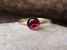 Garnet Gold Ring, Red Gemstone Stacking Ring, Dark Red Minimalist Ring, January Birthstone, Gold Filled Ring, Garnet jewelry, Red Stone Ring This red garnet gold stacking ring will be a perfect gift for women. It is made of 14k gold filled and garnet stone. Measurements: Size- all The center stone is 6 mm The ring will be packed in a gift box. FOR MY RINGS COLLECTION HERE: https://www.etsy.com/il-en/shop/rebekajewelry?section_id=14282915&ref=shopsection_leftnav_9 TO GET TO MY SHOP: https://w Red Cabochon Ruby Ring In 14k Gold, 14k Gold Red Cabochon Ruby Ring, Fine Jewelry Red Birthstone Stackable Rings, Red Birthstone Stackable Rings Fine Jewelry, 14k Gold Red Cabochon Ring, 14k Gold Rings With Red Cabochon, 14k Gold Cabochon Red Ring, Red Gemstone Stackable Rings Fine Jewelry, Red Gemstone Stackable Rings In Fine Jewelry