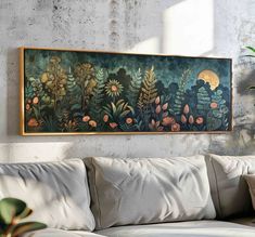 a painting hanging on the wall above a couch