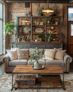 a living room filled with furniture and lots of plants on top of a wooden table