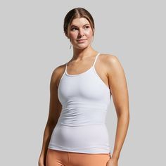 Breathability, functionality, adaptability—The Drop Shot Tank was designed to hit every mark. With a stretchy fabric that doesn’t restrict your range of motion and an ultra-flattering fit, this tank will have you hitting the perfect drop shot in next-level style. White Tops For Light Exercise With Seamless Construction, Versatile Fitted White Sports Bra, Versatile White Fitted Sports Bra, White Top With Seamless Construction For Light Exercise, White Seamless Tops For Light Exercise, White Gym Tops With Light Support, Fitted White Go-dry Activewear, White Racerback Tops For Athleisure, White Racerback Tops In Athleisure Style