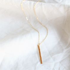 Bar Necklace - This simple necklace is available in sterling silver, rose gold filled or 14kt gold filled options. Our timeless vertical bar is a perfect everyday necklace. Great alone or layered this bar can be hammered or left smooth. -Petite vertical bar 26mm -Bar and chain are14kt gold filled or sterling silver -A high quality delicate link chain -Choose hammered or a light satin smooth finish 16 Inch Minimalist Charm Necklace For Everyday, Minimalist 14k Gold Bar Necklace With Rectangular Pendant, 14k Gold Rectangular Pendant Bar Necklace, Minimalist 14k Gold Bar Necklace For Everyday, Dainty Hammered Charm Necklaces For Everyday, Dainty Sterling Silver Bar Necklace, Dainty 16-inch Charm Necklace For Everyday, Minimalist 16 Inch Necklace For Everyday, Minimalist Hammered Jewelry With Rectangular Pendant