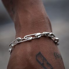 "Super cool chunky Safety Pin Bracelet in 925 Sterling silver with toggle clasps in both men's and women's sizes. Makes a unique bold statement piece by itself or layer it for more style. Matching Necklace https://etsy.me/3NvhSzX Bracelet Length 15cm / 5.9\" inches  16cm / 6.3\" 17cm / 6.7\" 18cm / 7.09\" 19cm / 7.48\" Every piece is handcrafted in Bali and made with Intention, Love, and Soul so that it can be felt by its wearer and ultimately change our energy and lives in a positive way. Each with its own story of insight and love, our pieces, like humans, are organic and asymmetrical in form.  Free worldwide shipping on all orders! Visit our Shop for more great styles! https://etsy.me/3JTDfZj Thank you for visiting our shop!" Men Jewelry Chain, Men Statement Pieces, Male Jewelry Aesthetic, Men's Bracelets, Mens Jewellery, Cool Jewelry, Bracelet Men, Jewelry For Men, Mens Bracelets