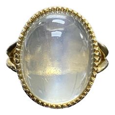 DeKara Designs Collection Art Deco Inspired Extremely Elegant Handmade Oval Cabochon Moonstone Engagement Ring. Metal- 18K Yellow Gold, .750. Stones- 1 Genuine Oval Cabochon Moonstone 19.67 Carats. Size- 8 3/4. FREE SIZING!!!! An Amazing One of a Kind Entirely Handmade Cabochon Huge Moonstone Engagement Created in 18K Yellow Gold. The ring features a beautiful high quality and clarity oval cabochon moonstone that is a whopping 19.67 carats! The moonstone is gracefully and professionally bezel set with perfection. The moonstone is surrounded by beautiful milgrain work which brings out the stone furthermore. The profile of the ring is truly amazing with flawless work that is finished with a high polish shine finish. This ring is one of a kind, and is entirely handmade. The moonstone is very Luxury Domed Cabochon Moonstone Ring, Luxury Oval Cabochons For Wedding, Luxury Spiritual Oval Cabochon Rings, Luxury Oval Cabochon Elegant Jewelry, Luxury White Oval Cabochon Moonstone Ring, Luxury Marquise Cabochon Jewelry, Luxury Rose Gold Oval Cabochon Jewelry, Moonstone Rings, Moonstone Engagement