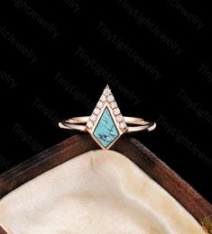 Unique Kite shaped Turquoise engagement ring, rose gold ring, round cut diamond/ moissanite ring  Art deco Jewelry Vintage anniversary ring Description: -Stone: 5*8 mm kite cut turquoise  -Side Stone: about 0.1ct Diamond (G-H; VS-SI)/Moissanite            -Total Weight: about 2.33g -Metal: 14k or 18k solid gold Available in yellow, white or rose solid 14k or 18k gold. ✦Find More Unique Art deco Rings： https://www.etsy.com/shop/TinyLightJewelry?section_id=36513259 CUSTOM SERVICE Our rings are cus Elegant Turquoise Diamond Ring, Elegant Diamond Turquoise Ring For Anniversary, Elegant Turquoise Diamond Ring For Anniversary, Turquoise Diamond Ring With Diamond Accents As Gift, Fine Jewelry Diamond Turquoise Ring For Anniversary, Elegant Diamond Turquoise Ring As A Gift, Elegant 14k Gold Turquoise Promise Ring, Turquoise Diamond Ring As A Gift, Turquoise Diamond Ring As Gift