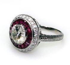 "𝐃𝐞𝐬𝐜𝐫𝐢𝐩𝐭𝐢𝐨𝐧 : *Antique Ruby Double Halo Ring, Round Cut CZ Diamond Vintage Ring, Woman's Engrave Shank Ring, Art Deco Engagement Ring, Birthday Gift Ring. ❖ 𝐃𝐢𝐚𝐦𝐨𝐧𝐝 𝐃𝐞𝐭𝐚𝐢𝐥𝐬 *Color : White, Pink *Clarity : VVS *Cut : Excellent *Center Stone Shape : Round Cut *Center Stone Size : 6.00 MM *Center Stone Weight : 0.85 CT *Side Stone Size : 1.40, 2.2*1.8 MM *Type : Cubic Zirconia (CZ) *We have all types of fancy & color Gemstone. For more queries please contact us immediately. ❖ 𝐑𝐢𝐧𝐠 𝐃𝐞𝐭𝐚𝐢𝐥𝐬 *Metal Purity : Solid Gold (10K, 14K, 18K); 925 Sterling Silver *Stamp : Yes (As per metal purity) *SKU : SR4479 *Making Process : Handmade > Crafted by our experienced craftsman. ❖ 𝐂𝐮𝐬𝐭𝐨𝐦𝐢𝐳𝐚𝐭𝐢𝐨𝐧 *Buyer can Request change of rhodium color in 925 Silver Jewelr Exquisite Round Halo Ring Gift, Exquisite Halo Ring With Round Shape For Gift, White Ruby Ring With Center Stone For Anniversary, Anniversary Ruby Ring In Diamond White, Diamond White Ruby Ring For Anniversary, Anniversary Diamond White Ruby Ring, Dazzling Round Ruby Ring With Halo Setting, Dazzling Ruby Ring With Halo Setting, Exquisite Ruby Ring With Center Stone