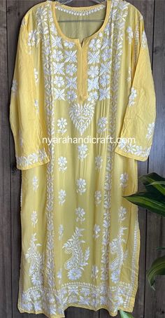 Soft, flowy Chikankari Kurta on modal cotton Hand embroidered. Embroidery designs may vary.  Kurta length: 46 inches Cotton Traditional Wear With Intricate Embroidery For Spring, Spring Cotton Traditional Wear With Intricate Embroidery, Summer Embroidered Mulmul Dupatta, Traditional Cotton Kurta Free Size, Traditional Cotton Kurta, Free Size, Traditional Free Size Cotton Kurta, Yellow Cotton Fabric With Chikankari Embroidery, Yellow Embroidered Cotton Kurta, Cotton Anarkali Kurta With Cutwork