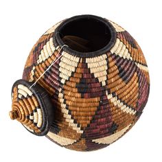 a woven basket with a lid and handle