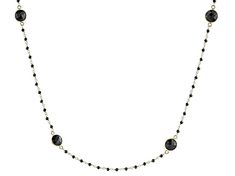 26.00ctw round black spinel 18k yellow gold over sterling silver necklace. Measures approximately .35"W. Lobster Clasp closure. Black Spinel Round Beads Jewelry For Gifts, Gift Black Spinel Round Bead Jewelry, Yellow Gold Black Spinel Jewelry As A Gift, Yellow Gold Necklace With Black Diamonds As Gift, Fine Jewelry With Black Diamonds In Gold, Fine Jewelry In Gold With Black Diamonds, Gold Faceted Round Necklace, Black Round Jewelry With Adjustable Chain, Elegant Round Faceted Beads Jewelry