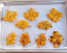 some food is sitting on a baking sheet and ready to be cooked in the oven