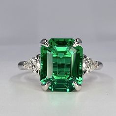 "The ring pictured is emerald cut emerald This ring can be made with many different stone colors Message us for pricing on different color/type stones Emerald is the birthstone of May for emerald earrings click here: https://etsy.me/3AN4nqW for emerald rings click here: https://etsy.me/3JIov0a for emerald pendants click here: https://etsy.me/3Td2gnv -Approximate total carat weight:  3.95ctw. diamond equivalent  -Center Stone Size:  10x8mm approx. 3.55ct diamond equivalent -Center Stone Shape: em 5 Carat Emerald Ring, Emerald Rings, Emerald-cut Emerald Gemstone With Center Stone, Vs Clarity Emerald-cut Green Emerald Ring, Green Faceted Emerald-cut Emerald Ring, Exquisite Emerald-cut Emerald Ring, Luxury Faceted Emerald Rings, Emerald Stone Rings, Emerald Ring Vintage