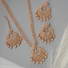 This Beautiful Rose Gold Polki Stone Long Mala Necklace Rani Haar Set for all Vibrant colors for your special events.    Set Includes: Necklace, Tikka and Chandbali Earrings  Dimension:- necklace:- Length 13.5"  Earrings:- Drop Length 2.5"  Approximately. Glamorous Rose Gold Necklaces For Party, Glamorous Rose Gold Party Necklace, Glamorous Festive Jewelry For Reception, Glamorous Handmade Necklaces For Celebration, Glamorous Gold Bridal Necklace For Festive Occasion, Rose Gold Bridal Necklace For Party, Elegant Pink Necklace With Intricate Design, Glamorous Gold Bridal Necklace For Celebrations, Elegant Pink Necklace For Reception