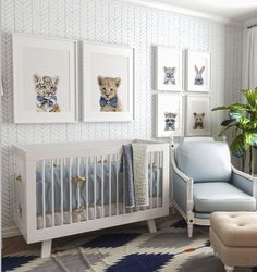 a baby's room decorated in blue and white with pictures on the wall, including a crib