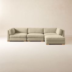 a large sectional couch sitting on top of a white floor