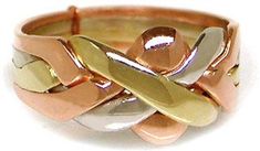 This Puzzle Ring consists of four interlocking bands. It is a true puzzle and will fall apart. Each band is made of solid 14K Yellow, White, and Rose gold. It is not gold plated or hollow. It measures approximately 10 mm on the face and 3 mm on the bottom (shank of the ring). Measurements may vary slightly based on size ordered. This ring is available in sizes from 4 to 8 with half size increments. Please note this ring is designed to be a delicate ring and is best suited for a ladies hand. Color combinations may vary from that pictured. It is not Hollow or Plated.  Black spots on the surface of the ring picture are due to reflection of camera. The story is told that in ancient times a Turkish Nobleman was so in love with his wife that he wanted to be sure she was faithful to him while he Puzzle Rings, Puzzle Ring, Hinged Ring, Opposite Colors, Accesories Jewelry, Ring Pictures, Fort Collins, Delicate Rings, Ring Box