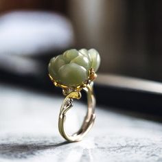 Elevate your style with our stunning silver ring featuring a vibrant jade flower. Handcrafted with meticulous attention to detail, this nature-inspired piece exudes elegance and uniqueness. Jade is revered for its healing properties, believed to bring balance and harmony to the wearer, promoting peace and prosperity. Whether you're treating yourself or searching for the perfect gift, this statement jewelry piece is sure to dazzle while imparting the soothing energy of jade. Add a touch of nature Luxury Jade Wedding Ring, Exquisite Jade Jewelry For Weddings, Fine Jewelry With Green Flower Design, Spiritual Jade Jewelry For Weddings, Elegant Flower Shaped Jade Jewelry, Nature-inspired Flower Gemstone Jewelry, Green Gemstone Flower Ring, Handmade Jade Jewelry For Weddings, Green Flower Shaped Jewelry For Wedding