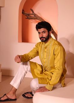 Introducing hasrat kurta with hand embroidery on hem & yoke consisting detailed thread, sequence, mirror and bead work with inside lining. Chanderi Bandhgala With Mirror Work And Long Sleeves, Long Sleeve Chanderi Bandhgala With Mirror Work, Designer Cotton Silk Bandhgala For Festivals, Navratri Long Sleeve Sherwani With Gota Work, Long Sleeve Sherwani With Mirror Work For Navratri, Navratri Long Sleeve Sherwani With Mirror Work, Bollywood Style Embroidered Cotton Silk Bandhgala, Navratri Sherwani With Gota Work And Long Sleeves, Eid Cotton Silk Bandhgala With Dabka Work