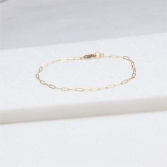 Anklets for WomenThis dainty gold anklet is stylish and perfect for everyday.  Choose your favorite chain style.  _______________________________________D E T A I L S-14kt gold filled or sterling silver-Choose your style of chain-A high quality shimmering link chain with a premium lobster clasp.  LENGTH - Please select from the drop down selection._______________________________________∙ EXTRA LOVE ∙Crafted with hand & heart just for you in the desert of our Arizona studio.All of our jewelry Skin-friendly Gold Minimalist Anklet, Minimalist Adjustable Chain Anklet, Minimalist Gold Anklet With Adjustable Chain, Everyday Gold Chain Anklets, Minimalist 14k Gold Filled Anklet As Gift, Minimalist Gold Chain Anklets, Minimalist Gold Chain Anklets As Gift, Minimalist Gold Anklets For Everyday, Minimalist Gold Chain Bracelet