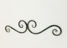 a metal wall decoration on a white background