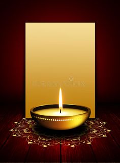 a lit candle in a bowl on a wooden table royalty illustration