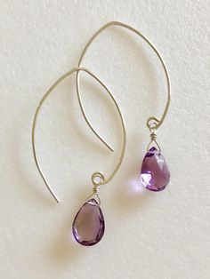 "Lovely genuine amethyst pear drops in Rose de France lilac pink color. Wrapped in Sterling silver on handmade earrings in simple modern design. Luxe AAA faceted gemstones are 11 x 8 mm. Total drop length is 1 7/8\". Also available in 14k gold fill. Beautiful spring color!" Purple Gemstone Teardrop Earrings, Purple Teardrop Wire Wrapped Earrings, Purple Teardrop Wire-wrapped Earrings, Handmade Amethyst Teardrop Earrings, Lavender Teardrop Jewelry With Ear Wire, Lavender Briolette Earrings For Gift, Teardrop Amethyst Earrings As Gift, Amethyst Teardrop Earrings For Pierced Ears, Teardrop Amethyst Earrings For Pierced Ears