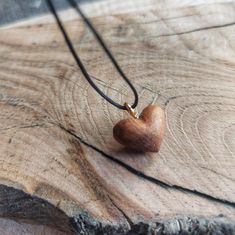 Each pendant is meticulously handcrafted from a selection of different wood types including mahogany, chestnut, ashwood, oak, and brazilwood. These tiny hearts are a testament to the elegance and diversity found in nature, making each piece one-of-a-kind. These delicate necklaces are perfect for nature enthusiasts and those who appreciate artisanal jewelry. They're lightweight, charming, and exude a rustic yet sophisticated vibe. Whether you're dressing up or going for a casual look, these necklaces complement any outfit and make a unique statement. Treat yourself or surprise a loved one with a gift that encapsulates the beauty of nature and the artistry of handcrafted jewelry. Artisan Natural Wood Necklace As A Gift, Handmade Artisan Wood Necklaces, Artisan Natural Wood Necklaces, Adjustable Artisan Natural Wood Necklace, Adjustable Natural Wood Necklace Nature-inspired, Delicate Necklaces, Heart Shaped Necklace, Tiny Heart, Mini Heart