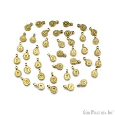 gold plated charms and pendants on white background