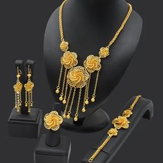 Indulge in luxury with this exquisite Dubai Gold Necklace Set, perfect for wedding parties. With its opulent design and superior craftsmanship, this set features a necklace, bracelet, earrings, and ring. Make a lasting impression and elevate your style with this luxurious jewelry set.' Metal Jewelry Sets With Clavicle Chain For Weddings, Wedding Jewelry Set With Metal Necklace, Elegant Rose Gold Alloy Jewelry Sets, Wedding Jewelry Set With Clavicle Chain, Gold Plated Clavicle Chain Jewelry Sets For Parties, Gold Plated Costume Jewelry Sets For Parties, Gold-plated Costume Jewelry Sets For Parties, Formal Gold Jewelry Sets With Clavicle Chain, Elegant Alloy Jewelry Sets For Gifts