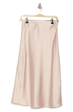 Elevate your wardrobe with this pull-on bias satin midi skirt for elegant, feminine style. 31" length (size S) Elasticized waist Pull-on style Satin construction 97% polyester, 3% spandex Machine wash cold, line dry Made in USA Model’s stats for sizing: 5’10” height, 34” bust, 27” waist, 35” hips. Model is wearing size S. Feminine Satin Skirt For Spring, Summer Midi-length Bias Cut Skirt, Spring Satin Relaxed Fit Skirt, Satin Midi-length Bottoms For Spring, Relaxed Satin Pencil Midi Skirt, Summer Satin Midi Bottoms, Spring Satin Midi Bottoms, Relaxed Fit Satin Midi Pencil Skirt, Feminine Satin Bottoms For Evening