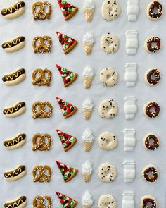 an assortment of cookies and pretzels are arranged on a sheet of white paper