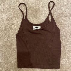 Bought From Uo. Washed Once, Never Worn. It’s A Super Cute And Versatile Summer Staple Piece. Flattering Cut That Contours The Body Well. Soft And Breathable Fabric. Tight And Cropped Fit. Brown Fitted Cropped Tank Top, Trendy Brown Camisole Top, Brown Ribbed Tank Top For Summer, Brown Fitted Tank Top, Casual Brown Cami Crop Top, Trendy Ribbed Brown Tank Top, Trendy Brown Ribbed Tank Top, Brown Ribbed Sleeveless Crop Top, Brown Ribbed Sleeveless Top