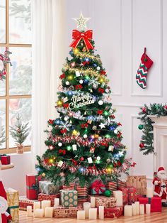 a decorated christmas tree with presents under it