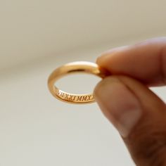 RHETA RING The simplicity and elegant crafted Personalized Name Medium Band Ring is the perfect symbol of love and devotion for your special day! Handmade 18k gold vermeil materials, with it's smooth gold accents and personalized engraved lettering. Give it your perfect tough by adding your name, initials, or even a special date. This ring is a sophisticated and meaningful gift to give to yourself, your beloved one, or another important person in your life.  -- If you would a thinner version, you can find our Rhia Thin Band Ring below https://etsy.me/3P7JVXB -- If you would a bold version, you can find our Reina Thin Band Ring below *MATERIAL:  -- 100% Recycled Sterling Silver - This solid, precious metal is a classic that lasts forever. While it may darken over time, with continuous care Simple Gold Engraved Ring For Anniversary, Timeless Adjustable Midi Rings As Gift, Minimalist Initial Ring With Engraving For Promise, Adjustable Ring With Engraved Text For Promise, Adjustable Promise Ring With Engraved Text, Timeless Stackable Engraved Ring For Anniversary, Classic Rose Gold Midi Rings, Timeless Stackable Rings As Gift, Classic Engraved Midi Rings For Wedding