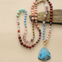 🎉💖 Introducing the eclectic Handmade Jade, Jasper, Agate, and Pyrite T Bar Necklace - 33.5 Inches! 🌟📿 Immerse yourself in the symphony of nature with this meticulously handcrafted necklace. It features a striking combination of Jade, Jasper, Agate, and Pyrite beads, each bringing its unique energy and beauty to this 33.5-inch masterpiece. 🎨🌈 The Jade, typically connected to the Heart Chakra (Anahata) 💚💓, represents purity and tranquillity, promoting love and harmony. The Jasper, often as Nature-inspired Agate Jewelry For Meditation, Healing Natural Stone Beaded Necklaces, Nature-inspired Beaded Necklaces For Healing With Natural Stones, Healing Natural Stones Beaded Necklace, Nature-inspired Gemstone Beaded Necklace For Wellness, Nature-inspired Gemstone Beads Necklace For Meditation, Bohemian Ocean Jasper Necklaces For Gifts, Spiritual Jasper Beaded Necklace With Gemstone, Bohemian Ocean Jasper Necklaces As Gifts