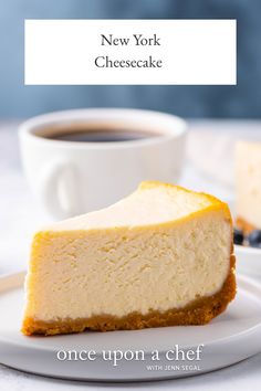 a slice of cheesecake on a plate with a cup of coffee in the background