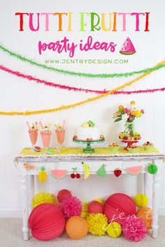 a table topped with lots of cake next to a sign that says tutti frutti party ideas