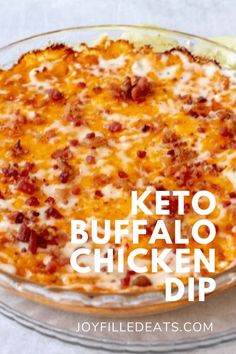 the keto buffalo chicken dip is in a glass dish with cheese and bacon on top